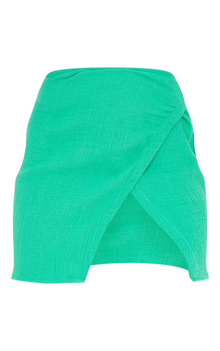 Mini-jupe portefeuille en maille gaufrée vert vif